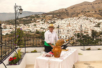 Paco serving Competa's Spanish jamon specialty at a family wedding at Villa Chile, Analucia.